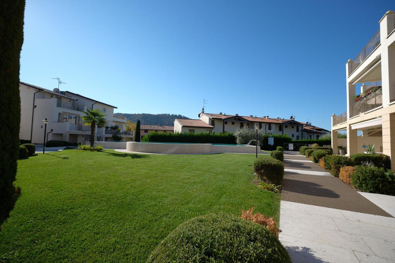 ApartmentsGarda - Corte dei Molini Esterno foto